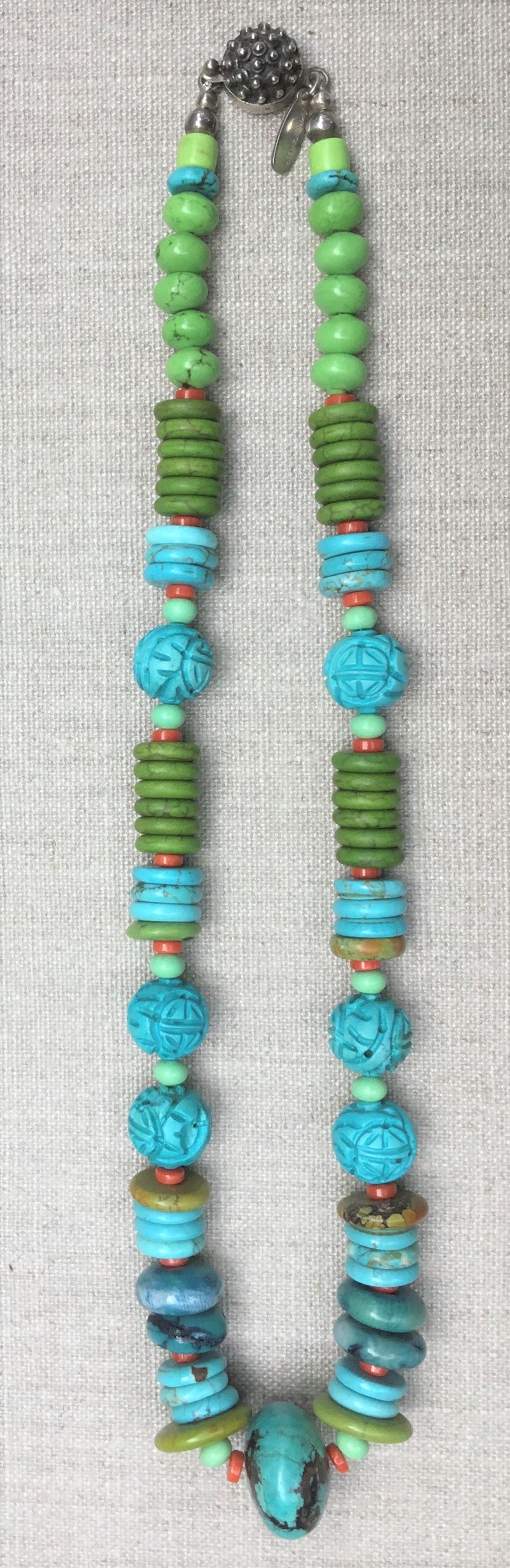 Necklace turquoise with carved beads